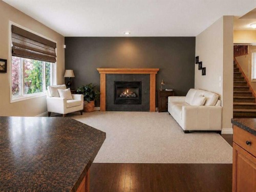 188 Everwillow Park Sw, Calgary, AB - Indoor Photo Showing Living Room With Fireplace