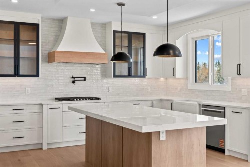 87 Sundown Crescent, Cochrane, AB - Indoor Photo Showing Kitchen With Upgraded Kitchen