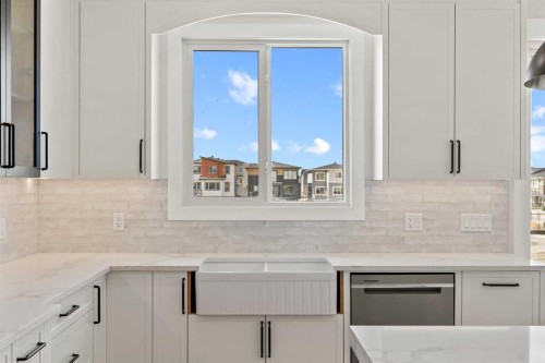 87 Sundown Crescent, Cochrane, AB - Indoor Photo Showing Kitchen With Upgraded Kitchen