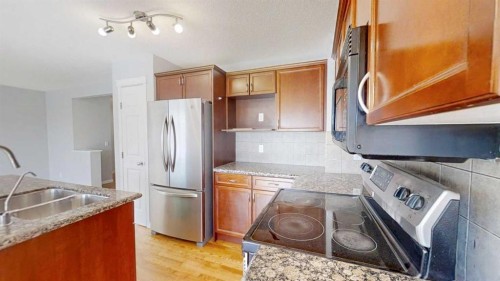 124 Everglen Way Sw, Calgary, AB - Indoor Photo Showing Kitchen With Double Sink
