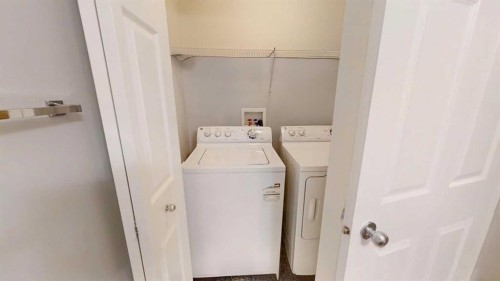 124 Everglen Way Sw, Calgary, AB - Indoor Photo Showing Laundry Room