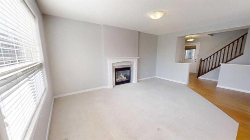 124 Everglen Way Sw, Calgary, AB - Indoor With Fireplace