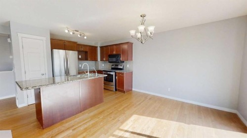 124 Everglen Way Sw, Calgary, AB - Indoor Photo Showing Kitchen With Stainless Steel Kitchen