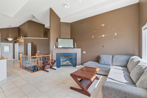 215 Rocky Ridge Drive Nw, Calgary, AB - Indoor Photo Showing Living Room With Fireplace