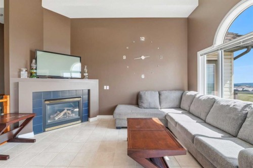 215 Rocky Ridge Drive Nw, Calgary, AB - Indoor Photo Showing Living Room With Fireplace