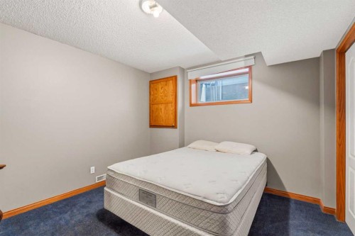 215 Rocky Ridge Drive Nw, Calgary, AB - Indoor Photo Showing Bedroom
