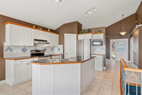 215 Rocky Ridge Drive Nw, Calgary, AB - Indoor Photo Showing Kitchen With Double Sink