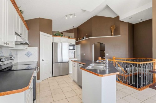 215 Rocky Ridge Drive Nw, Calgary, AB - Indoor Photo Showing Kitchen With Double Sink