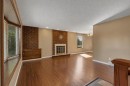 335 Queensland Drive Se, Calgary, AB  - Indoor With Fireplace 