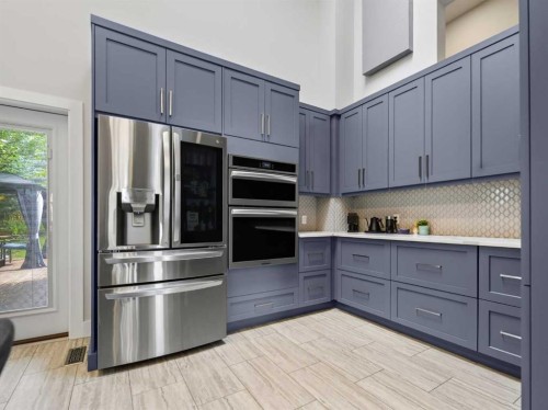 115 Wood Valley Court Sw, Calgary, AB - Indoor Photo Showing Kitchen With Stainless Steel Kitchen