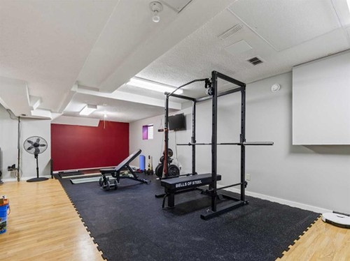 115 Wood Valley Court Sw, Calgary, AB - Indoor Photo Showing Gym Room