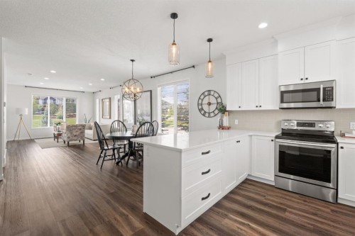 45 Willow Green Way, Cochrane, AB - Indoor Photo Showing Kitchen With Upgraded Kitchen