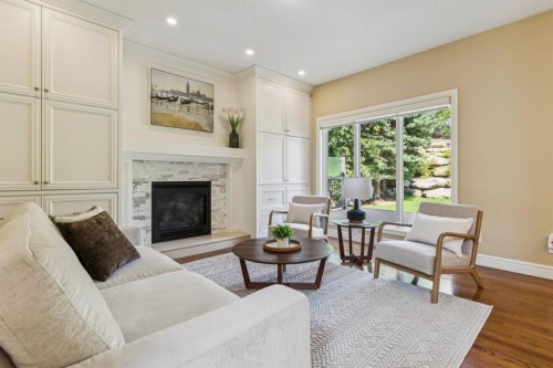 174 Sienna Hills Drive Sw, Calgary, AB - Indoor Photo Showing Living Room With Fireplace