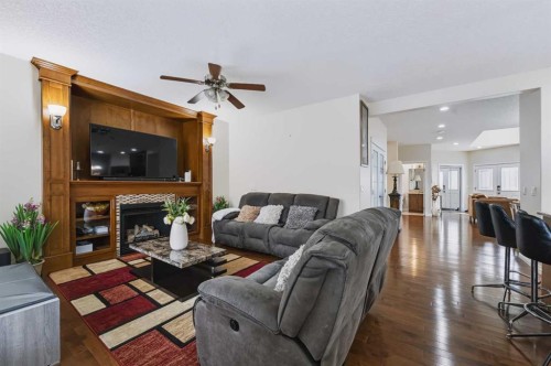 8245 Saddlebrook Drive Ne, Calgary, AB - Indoor Photo Showing Living Room With Fireplace