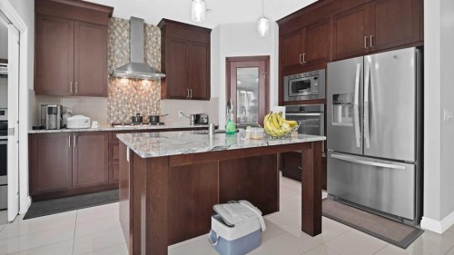149 Saddlestone Drive Ne, Calgary, AB - Indoor Photo Showing Kitchen With Upgraded Kitchen