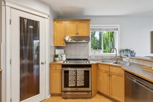 258 West Ranch Place Sw, Calgary, AB - Indoor Photo Showing Kitchen With Double Sink