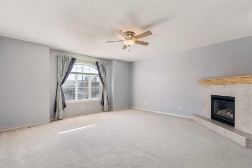 258 West Ranch Place Sw, Calgary, AB - Indoor Photo Showing Other Room With Fireplace