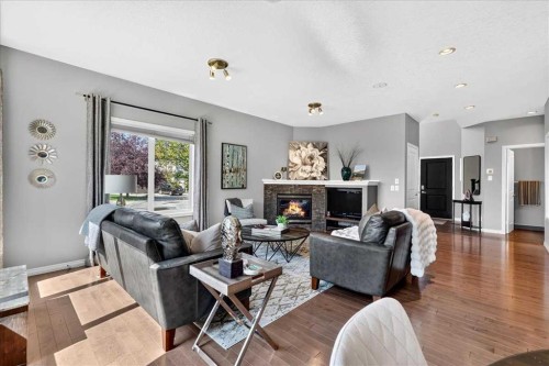 122 Royal Birkdale Crescent Nw, Calgary, AB - Indoor Photo Showing Living Room With Fireplace