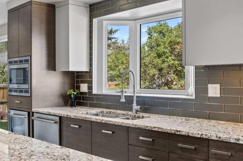 8 Millside Court Sw, Calgary, AB - Indoor Photo Showing Kitchen With Double Sink With Upgraded Kitchen