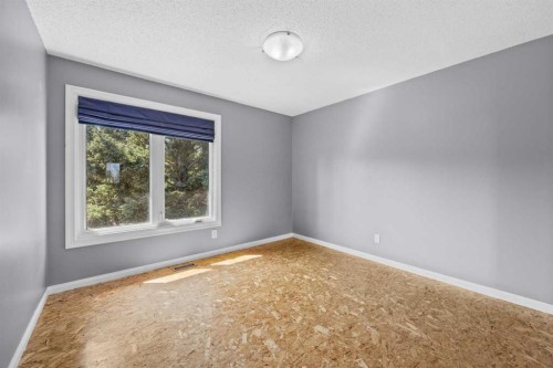 8 Millside Court Sw, Calgary, AB - Indoor Photo Showing Other Room