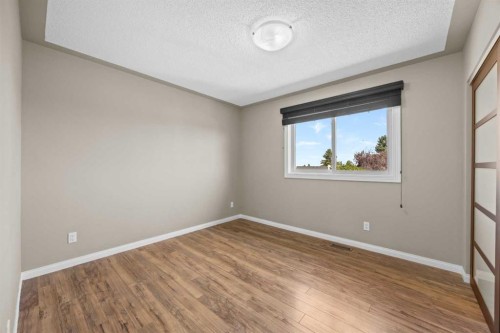 8 Millside Court Sw, Calgary, AB - Indoor Photo Showing Other Room