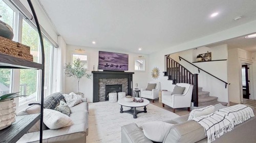 107 Auburn Sound Cove Se, Calgary, AB - Indoor Photo Showing Living Room With Fireplace