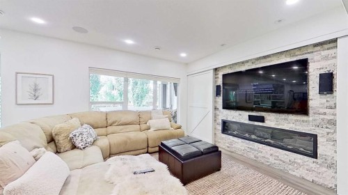 107 Auburn Sound Cove Se, Calgary, AB - Indoor Photo Showing Living Room With Fireplace