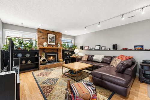 35 Rundlemere Place Ne, Calgary, AB - Indoor Photo Showing Living Room With Fireplace