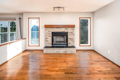 131 Edgebrook Close Nw, Calgary, AB - Indoor Photo Showing Living Room With Fireplace