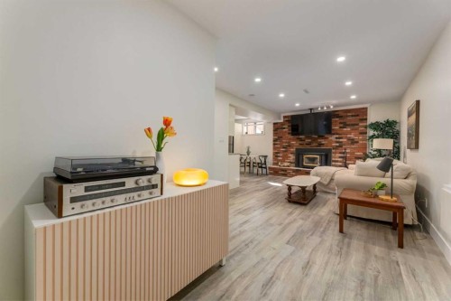 131 Thorncrest Road Nw, Calgary, AB - Indoor With Fireplace