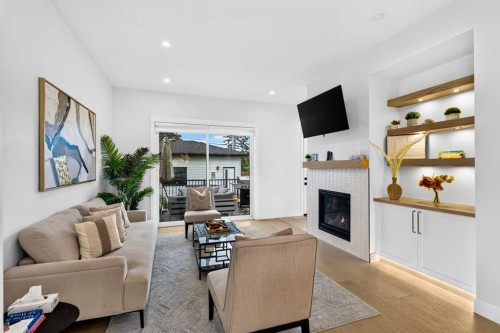236 30 Avenue Ne, Calgary, AB - Indoor Photo Showing Living Room With Fireplace