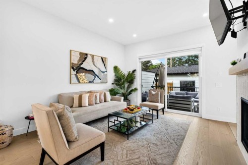 236 30 Avenue Ne, Calgary, AB - Indoor Photo Showing Living Room With Fireplace