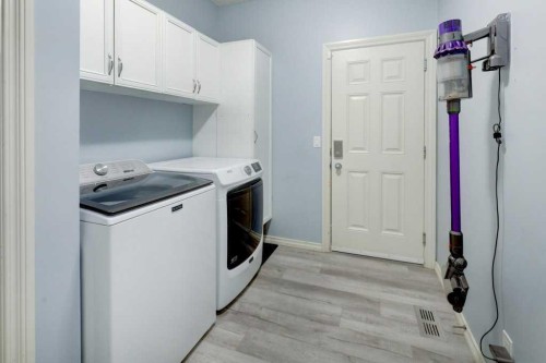 242 Crystal Green Point, Okotoks, AB - Indoor Photo Showing Laundry Room