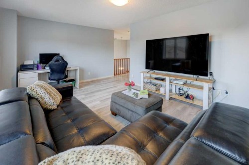 242 Crystal Green Point, Okotoks, AB - Indoor Photo Showing Living Room