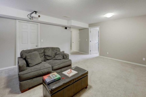 242 Crystal Green Point, Okotoks, AB - Indoor Photo Showing Living Room