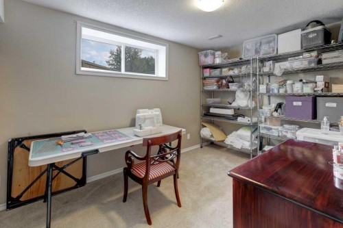 242 Crystal Green Point, Okotoks, AB - Indoor Photo Showing Other Room
