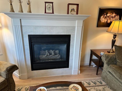 3338-1818 Simcoe Boulevard Sw, Calgary, AB - Indoor Photo Showing Living Room With Fireplace