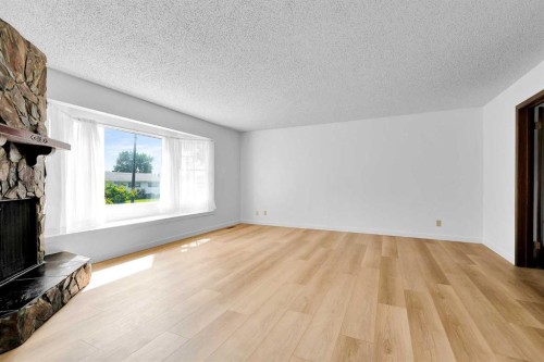 7819 7 Street Sw, Calgary, AB - Indoor Photo Showing Other Room With Fireplace