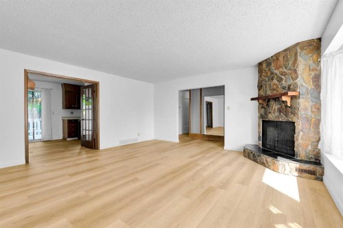 7819 7 Street Sw, Calgary, AB - Indoor Photo Showing Living Room With Fireplace