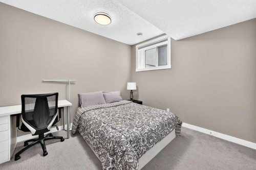 33 Aspen Summit Circle Sw, Calgary, AB - Indoor Photo Showing Bedroom
