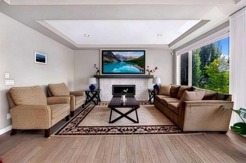 33 Aspen Summit Circle Sw, Calgary, AB - Indoor Photo Showing Living Room With Fireplace