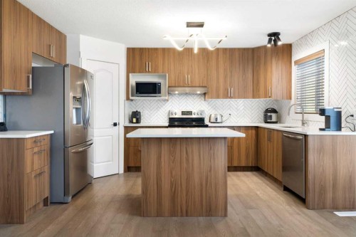 56 West Cedar Rise Sw, Calgary, AB - Indoor Photo Showing Kitchen With Stainless Steel Kitchen