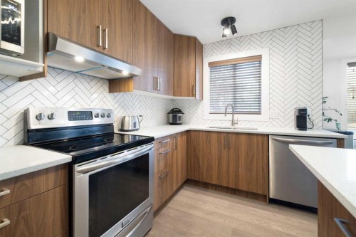 56 West Cedar Rise Sw, Calgary, AB - Indoor Photo Showing Kitchen With Stainless Steel Kitchen With Upgraded Kitchen