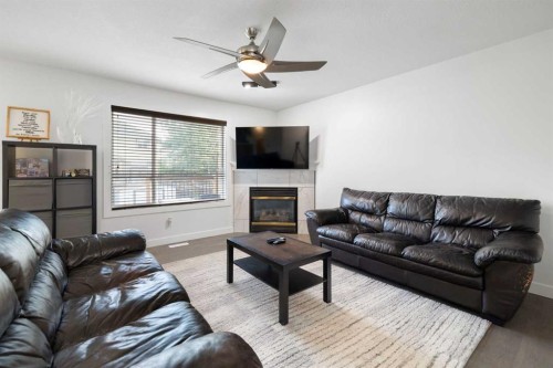 56 West Cedar Rise Sw, Calgary, AB - Indoor Photo Showing Living Room With Fireplace