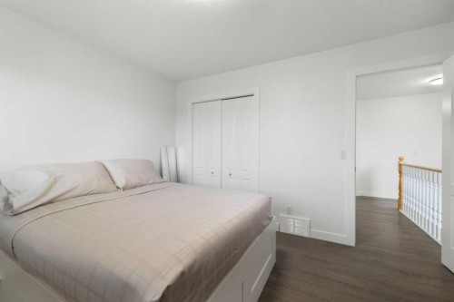 56 West Cedar Rise Sw, Calgary, AB - Indoor Photo Showing Bedroom