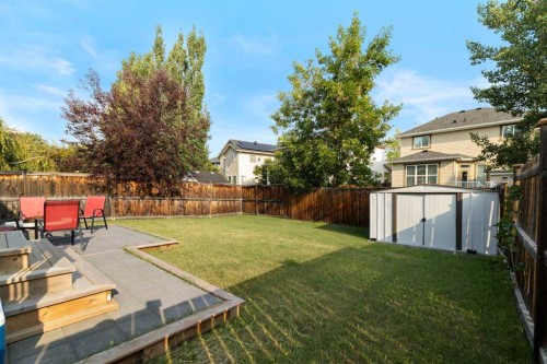 56 West Cedar Rise Sw, Calgary, AB - Outdoor With Backyard