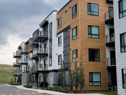2304-42 Cranbrook Gardens Se, Calgary, AB - Outdoor With Balcony With Facade