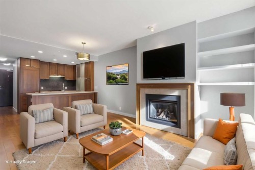 521-222 Riverfront Avenue Sw, Calgary, AB - Indoor Photo Showing Living Room With Fireplace