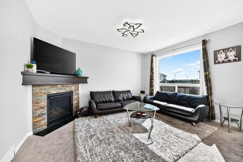 8 Skyview Point Terrace Ne, Calgary, AB - Indoor Photo Showing Living Room With Fireplace