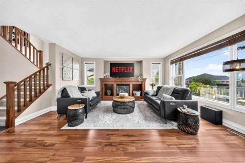 117 Evanspark Circle Nw, Calgary, AB - Indoor Photo Showing Living Room With Fireplace
